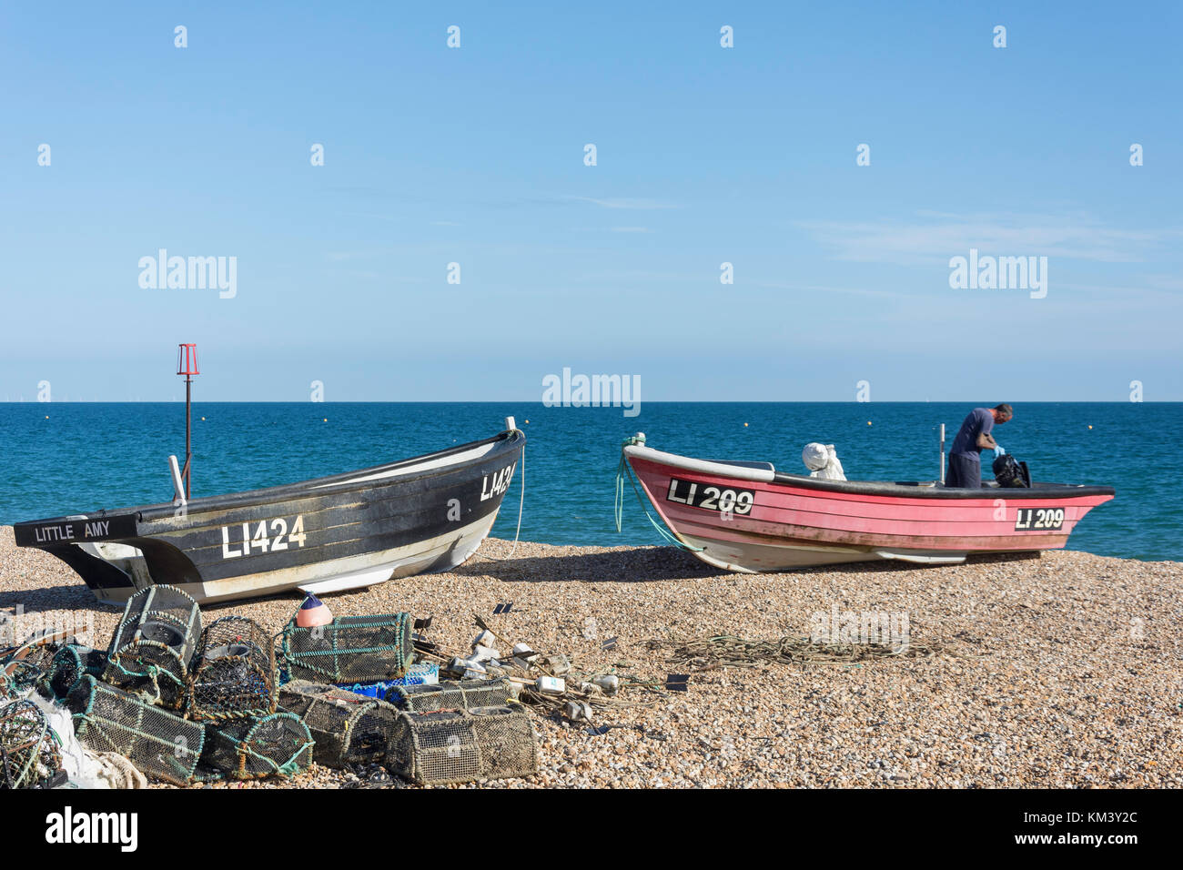 Fishing boat and lobster pots on beach, Bognor Regis, West Sussex, England, United Kingdom Stock Photo