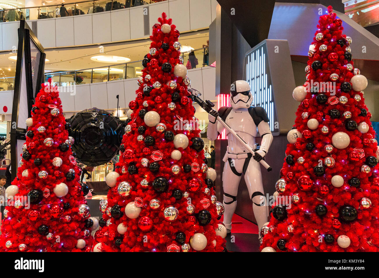 Star Wars theme Christmas with lifesize stormtrooper and red Christmas trees Stock Photo