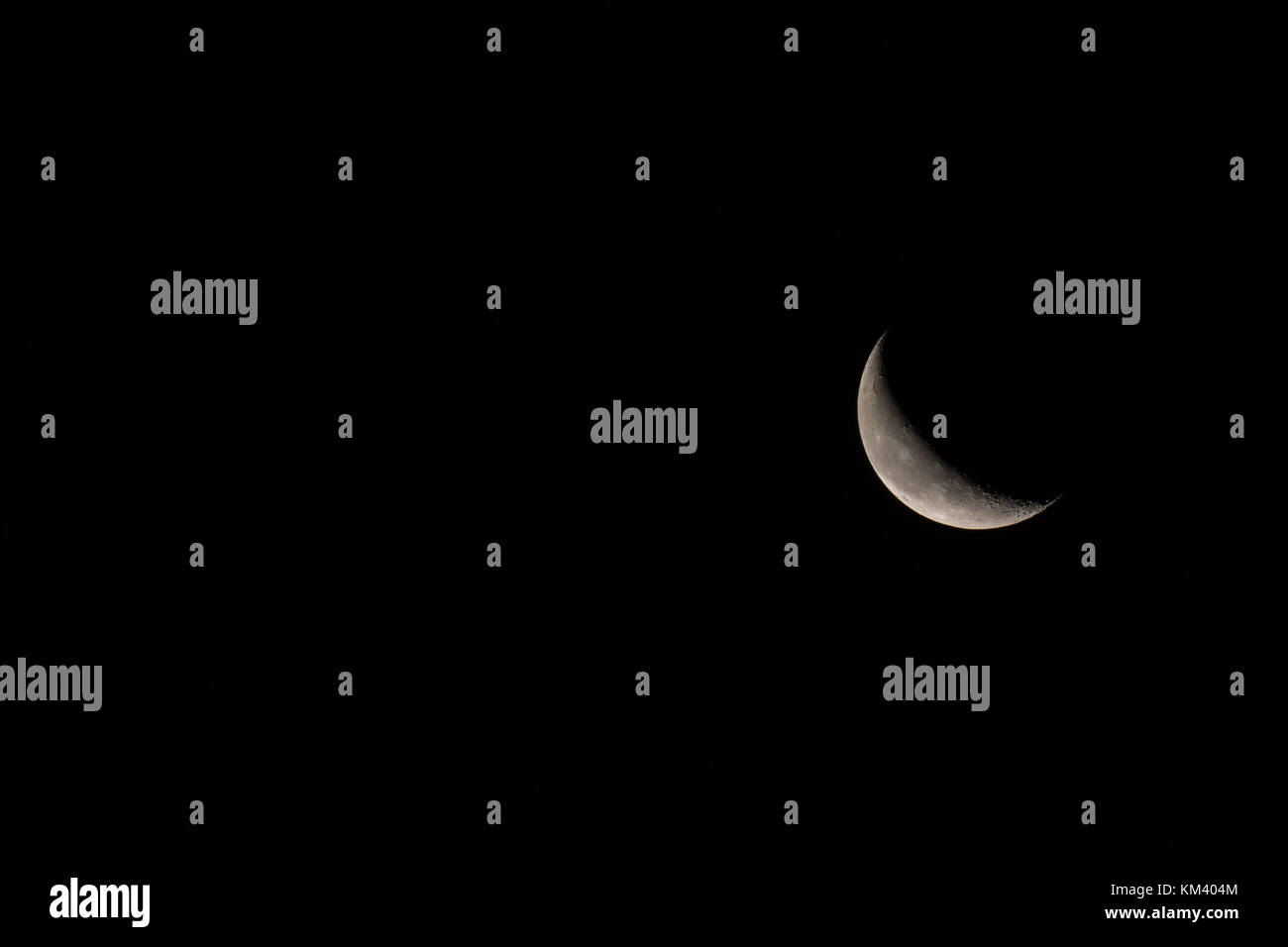 Waning crescent Moon with room on left of image for text or copy. Stock Photo