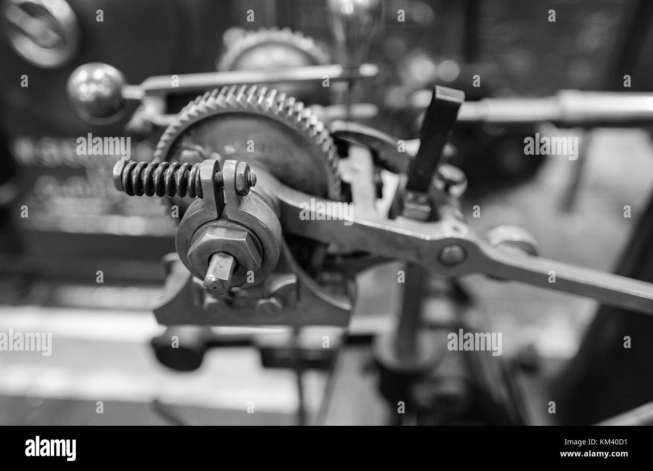 Old 20th century machinery showing gears, bolts, nuts in black and white Stock Photo