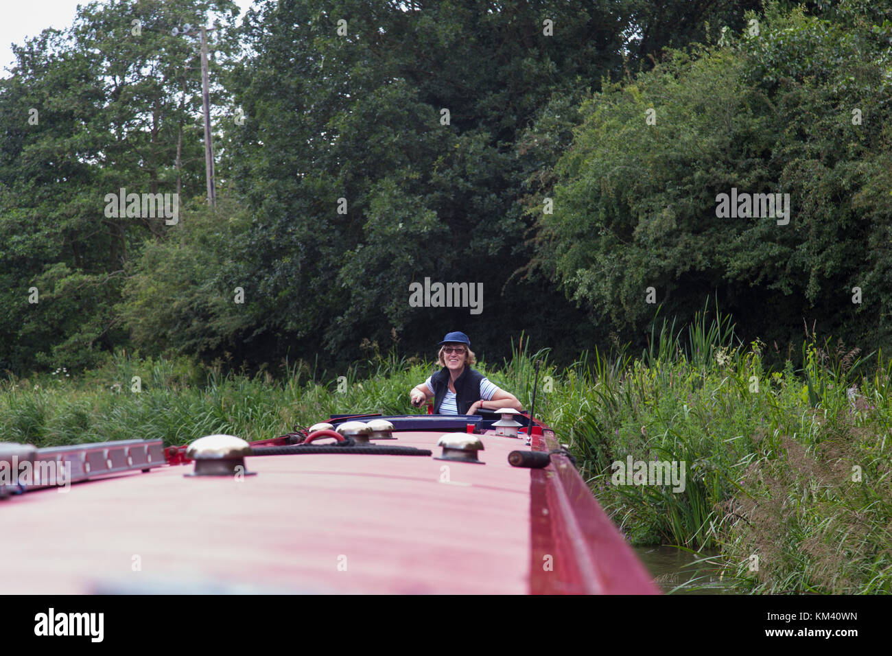 Woman steering boat hi-res stock photography and images - Alamy