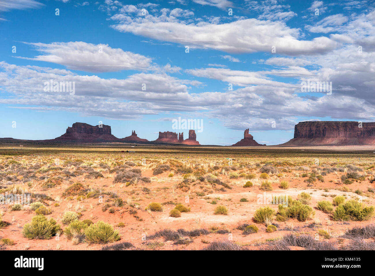 Monument Valley red sand region on the Arizona-Utah border, USA. Navajo Tribal Park and used for a location for many fomous Western films Stock Photo