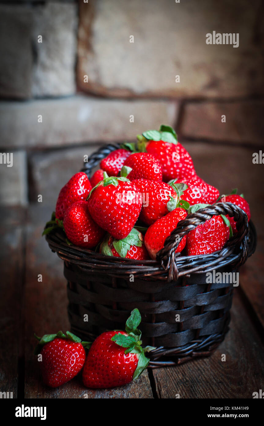 Basket Of Fresh Strawberries On Wooden Background Stock Photo - Alamy