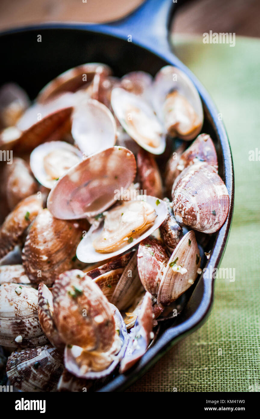 Cast Iron Skillet Of Delicious Fresh Steamer Clams With Garlic And
