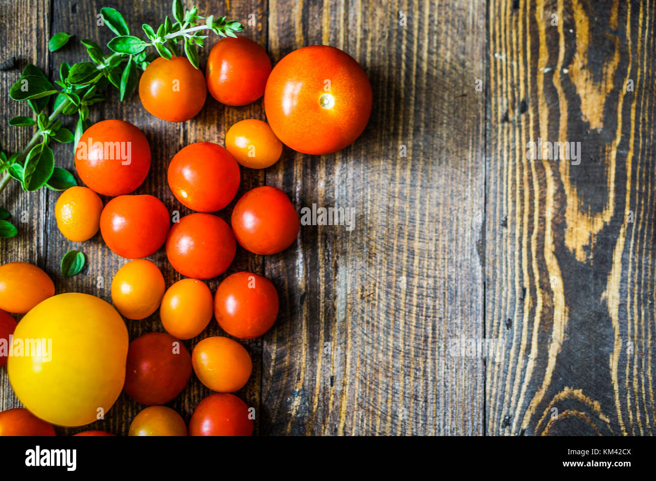 Rustic Tomato Color Colorful Tomatoes On Rustic Background Stock Photo - Alamy