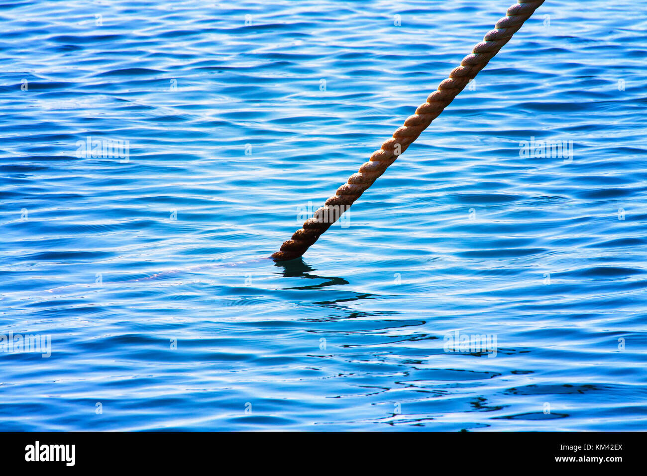 Boat Connection in Harbor, rope in the sea Stock Photo
