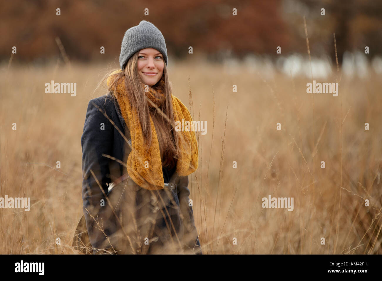 Woman walking field brown hi-res stock photography and images - Alamy