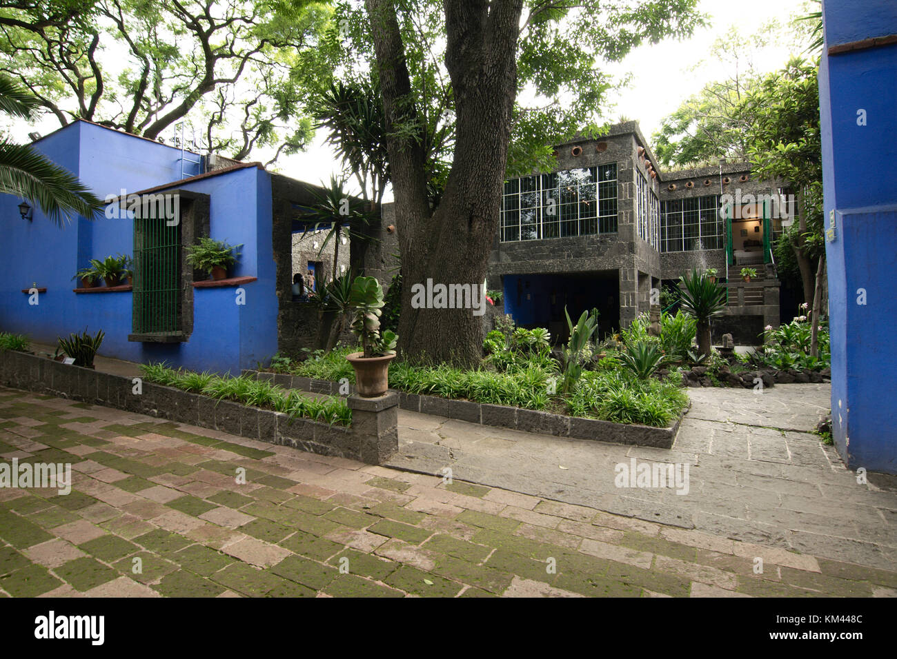 Mexico City, Mexico - 2017: Courtyard of the Frida Kahlo Museum, a historic house museum and art museum dedicated to her life and work Stock Photo