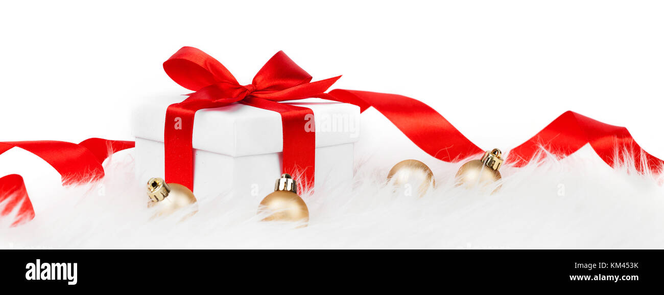 Gift box with red ribbon bow and christmas ball Stock Photo - Alamy