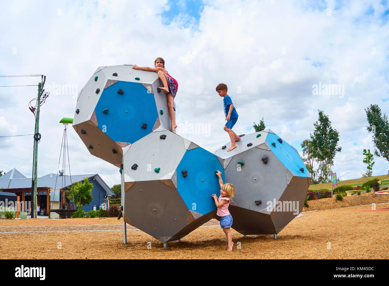 Children playing on climbing blocks at Tamworth Australia. Stock Photo