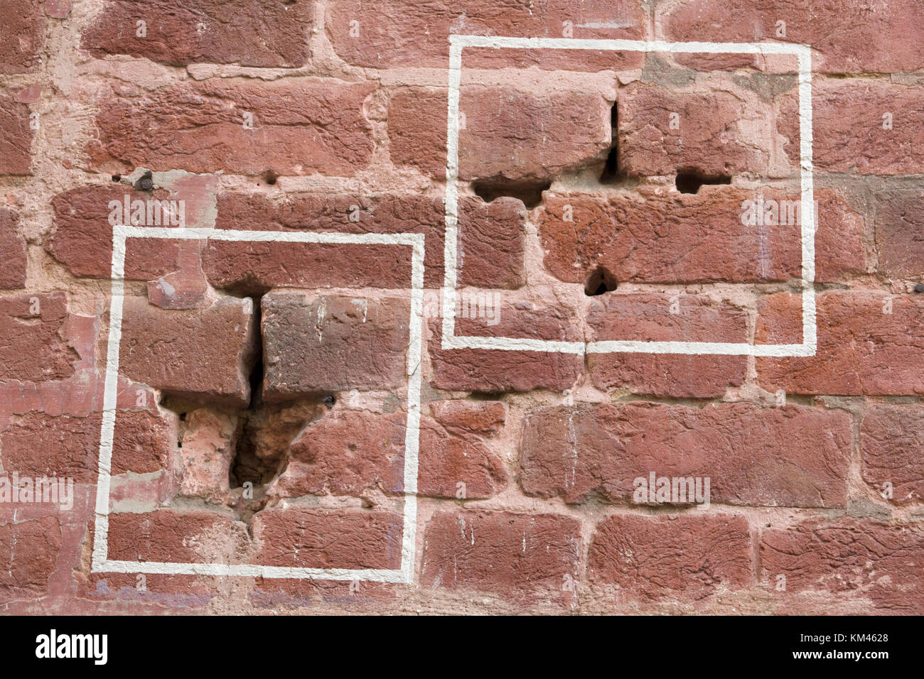 Machine gun bullet holes in brick wall at Jallianwala Bagh, Amritsar, where the British Army opened fire and massacred a crowd of unarmed protestors Stock Photo