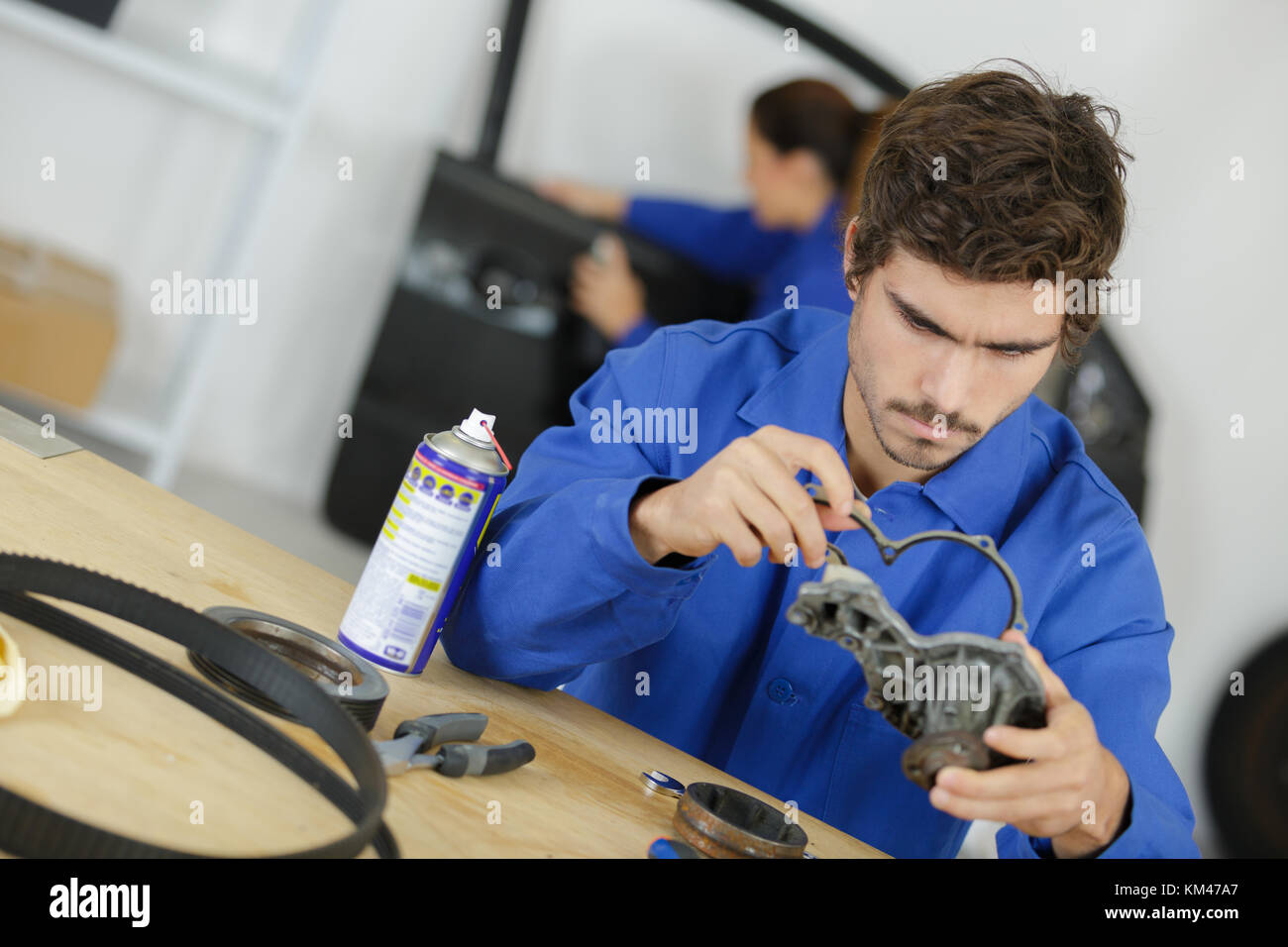 car mechanic hands in garage with old engine gasket Stock Photo Alamy