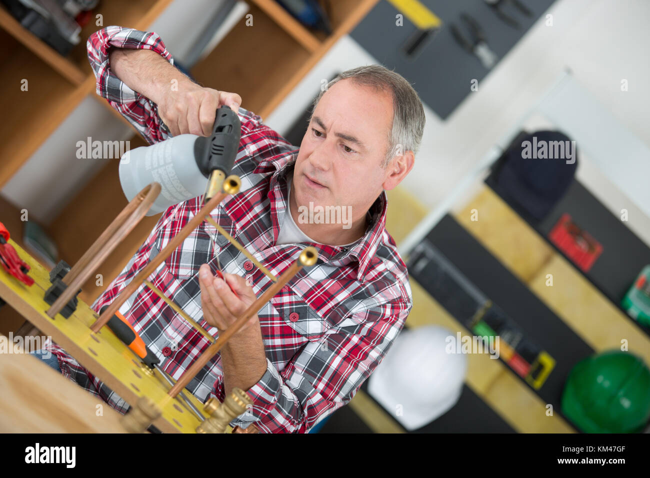 plumber using a blow torch Stock Photo Alamy