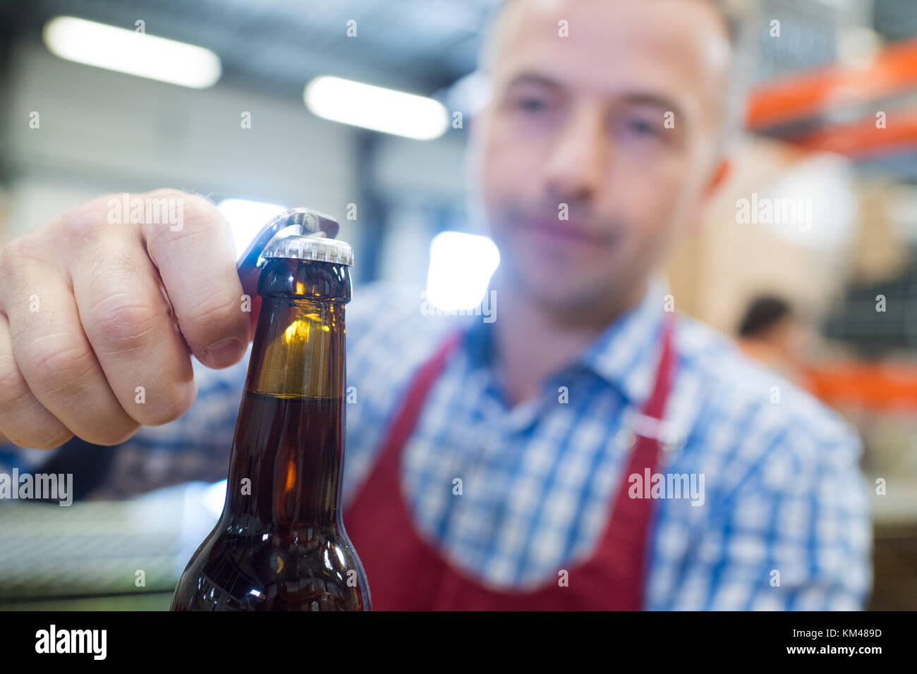 closeup of male opening beer bottle Stock Photo Alamy