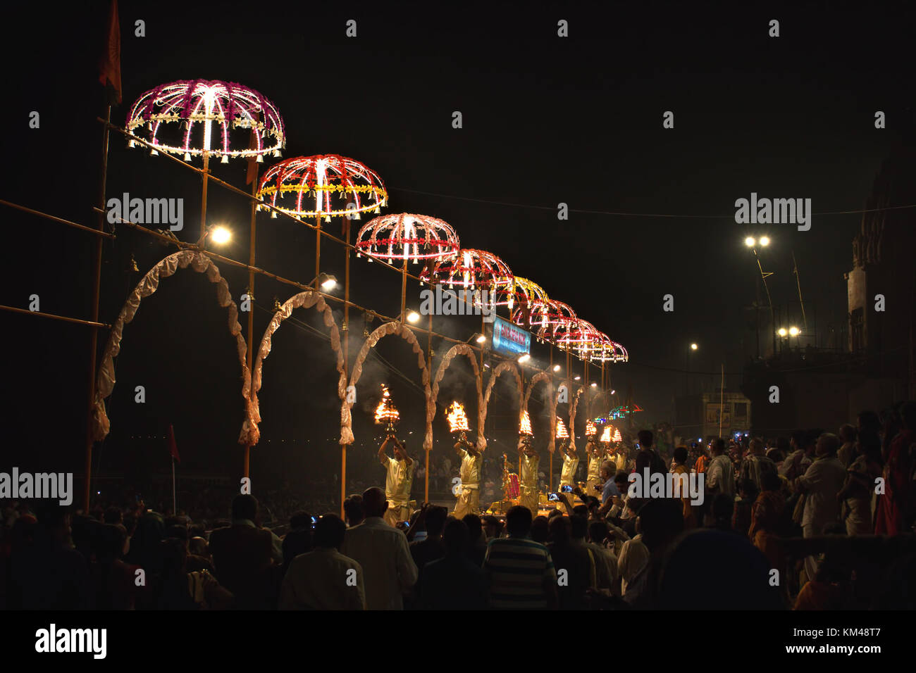 people watching a group of young priests performing aarti at Dashashwamedh Ghat by the river Ganges, Banaras, Varanasi, Kashi, India Stock Photo