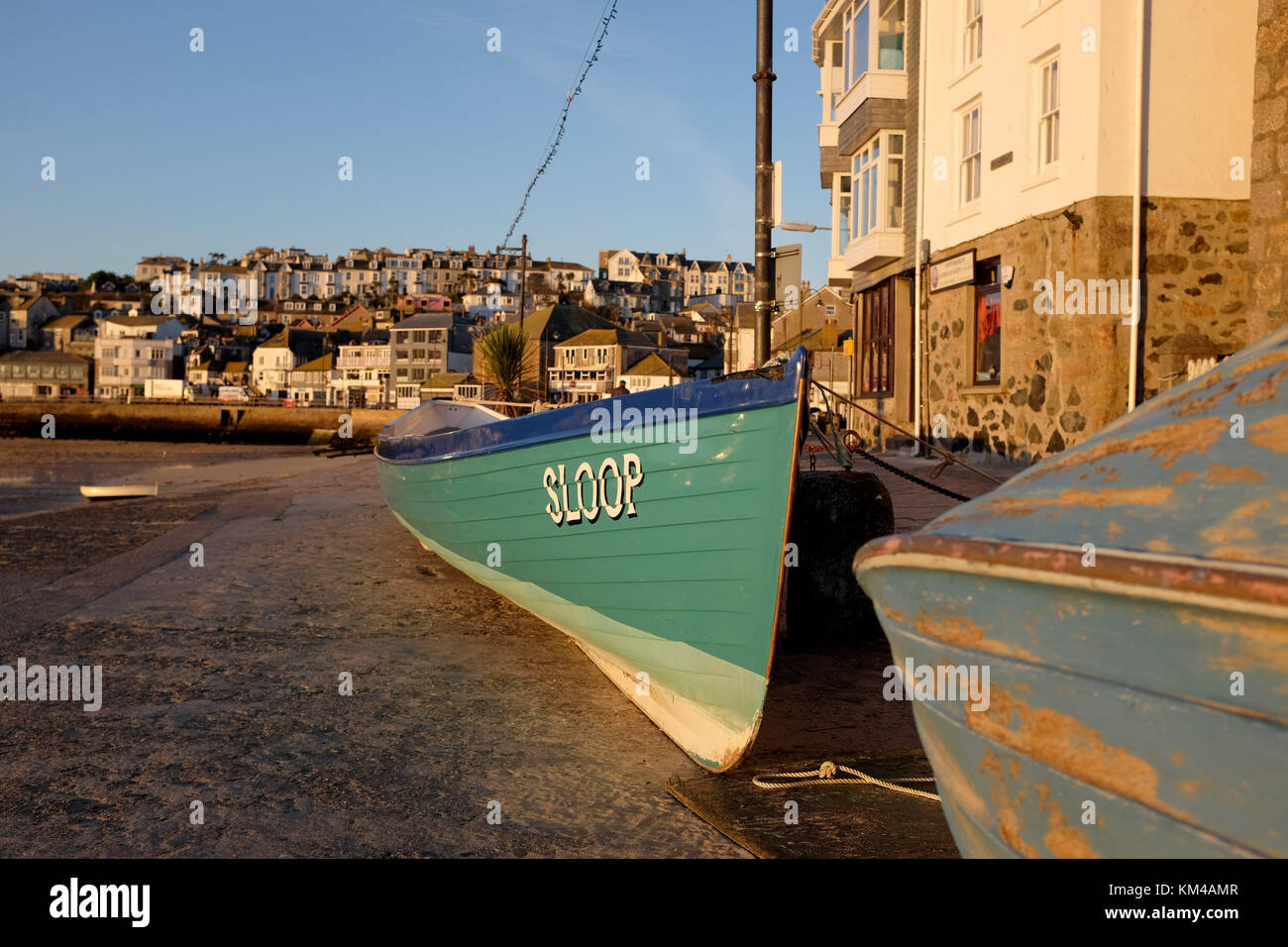 Cornish Gig rowing boat on the harbour at St Ives Cornwall UK Stock Photo