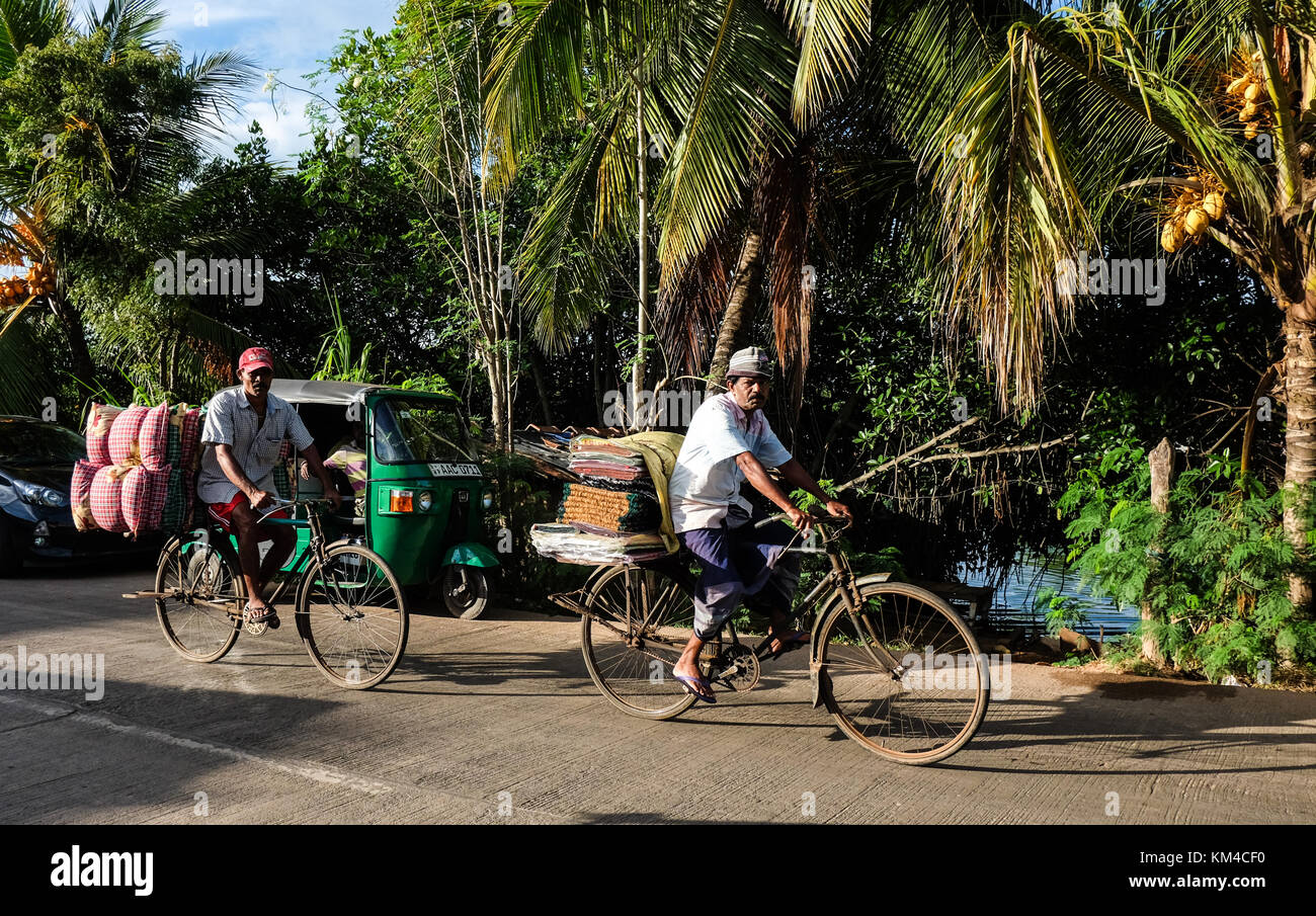 Colombo, Sri Lanka - Sep 5, 2015. People biking on rural road in ...