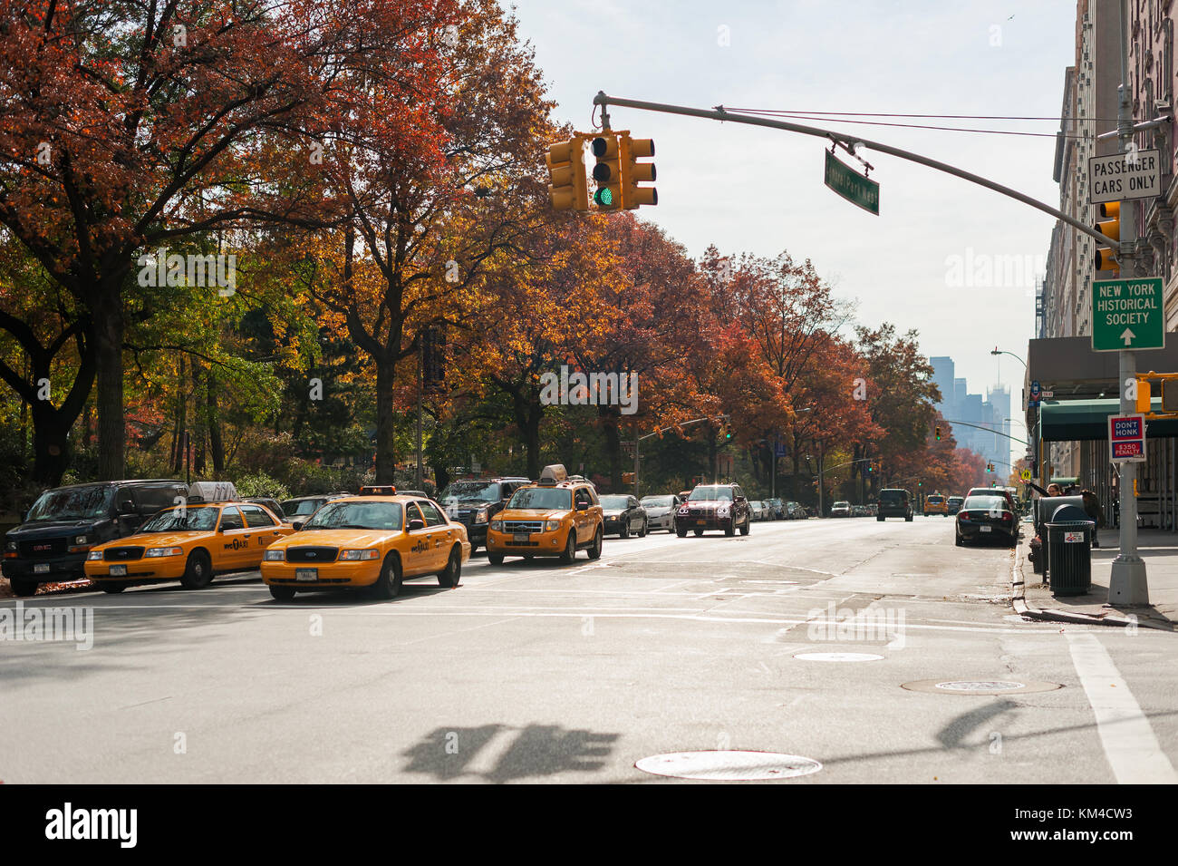 New York City, USA - Nov 14, 2011 : Yellow taxis in Central Park west in autumn. Stock Photo
