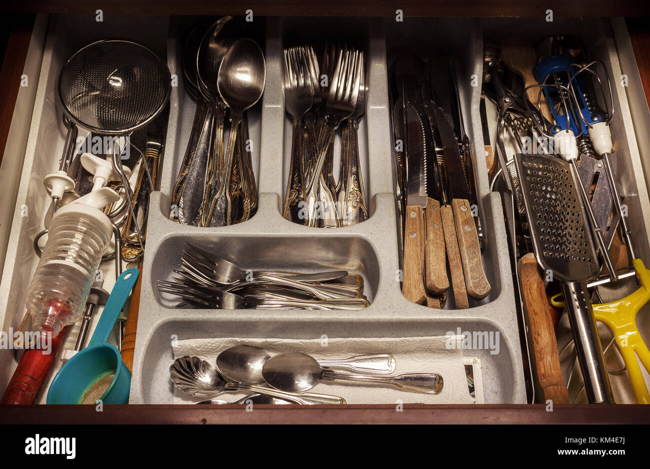 Closeup view of various utensils in drawer. Stock Photo