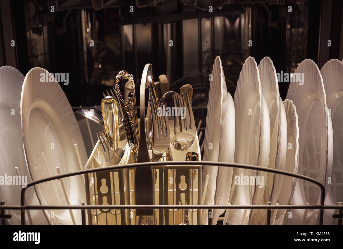 Clean dishes and accessories in dishwasher after washing Stock Photo