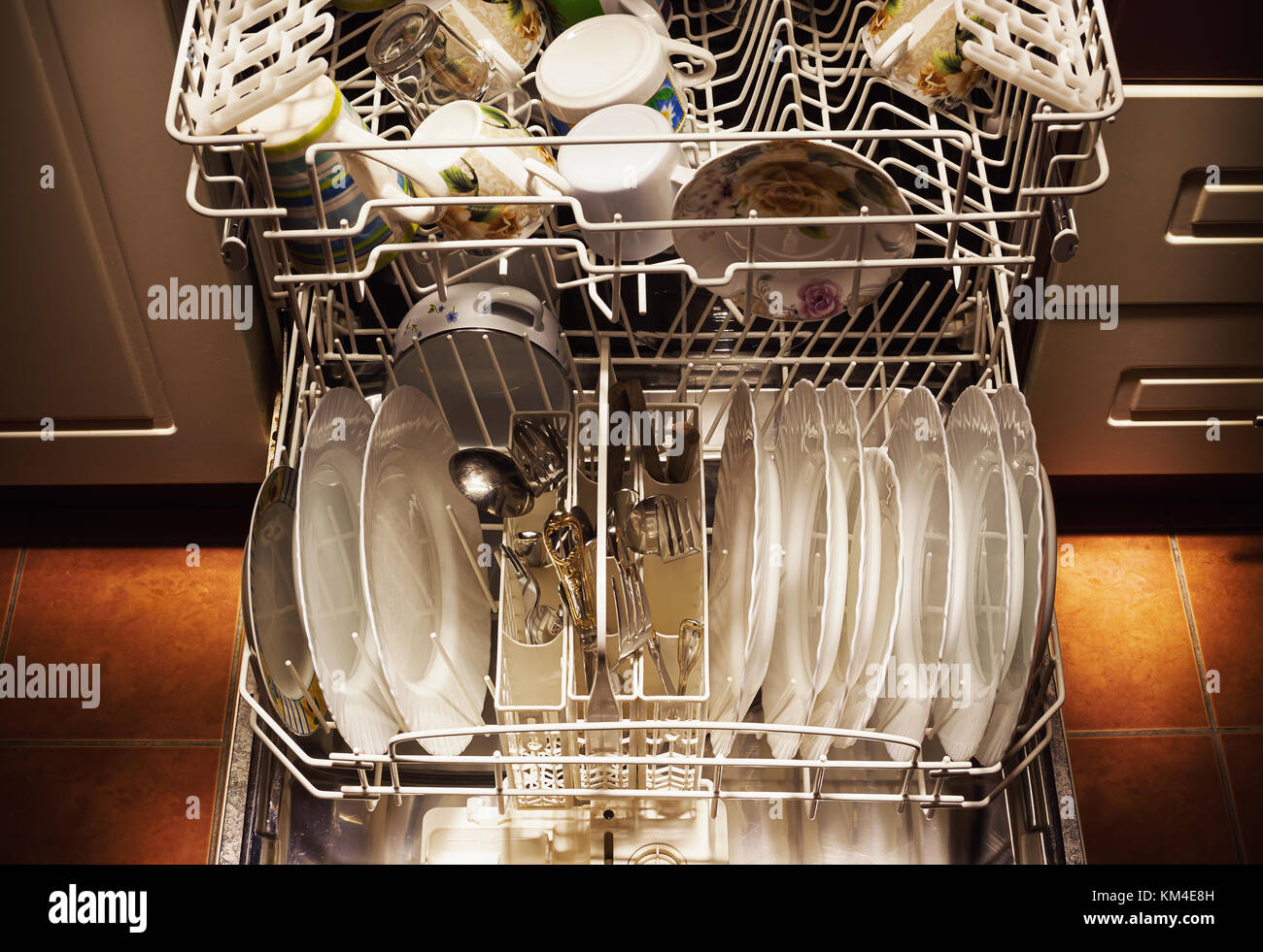 Clean dishes and accessories in dishwasher after washing Stock