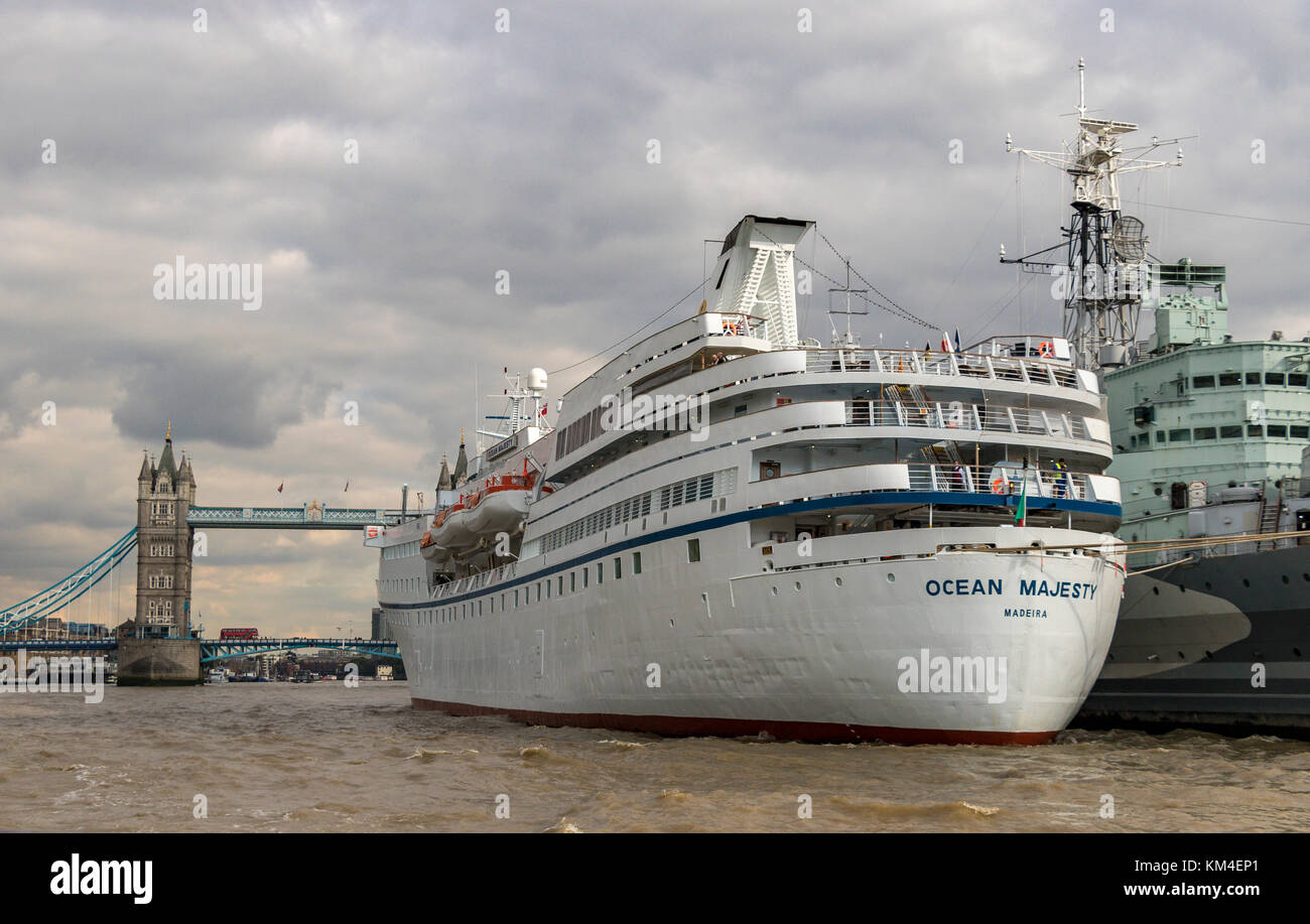 Hms Belfast With The Cruise Ship Mv Ocean Majesty Moored Along Side In The Pool Of London With Tower Bridge In The Background Stock Photo Alamy