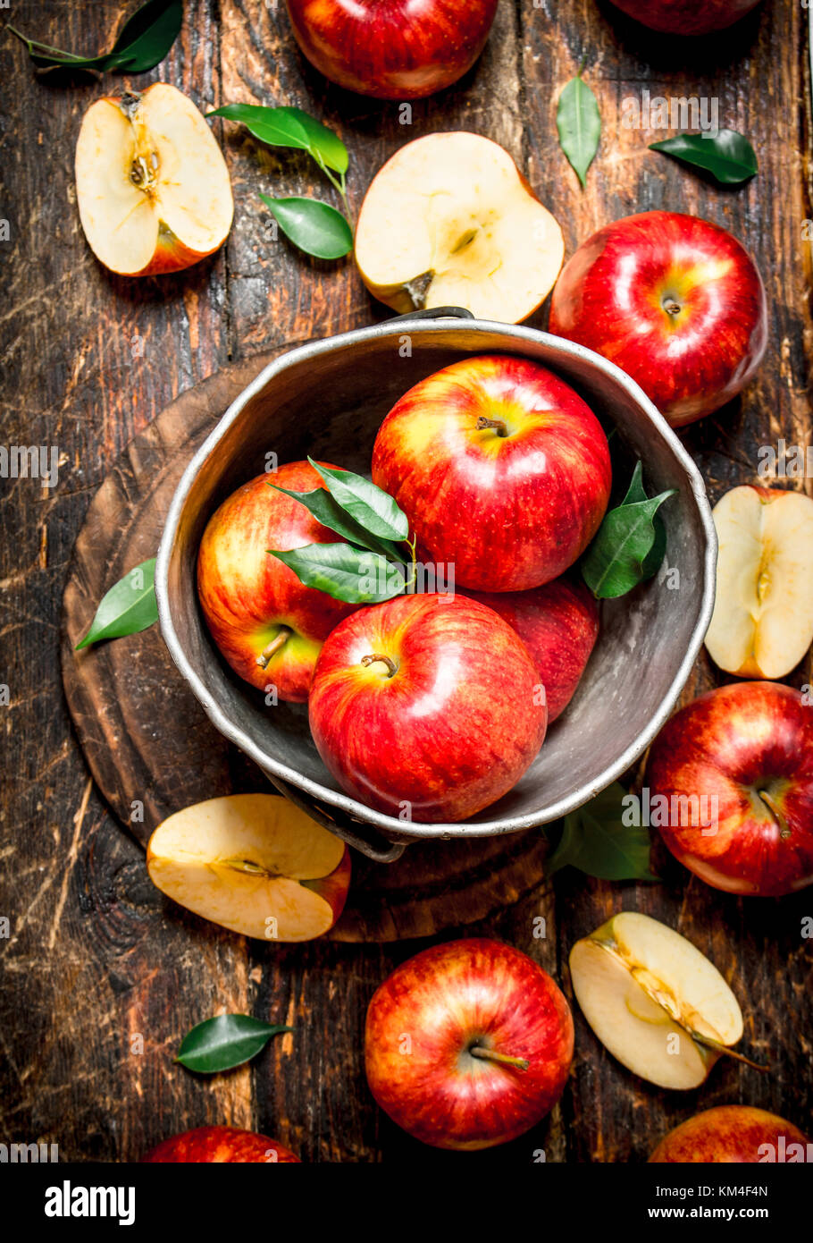 Red apples in an old bucket. On wooden background Stock Photo - Alamy