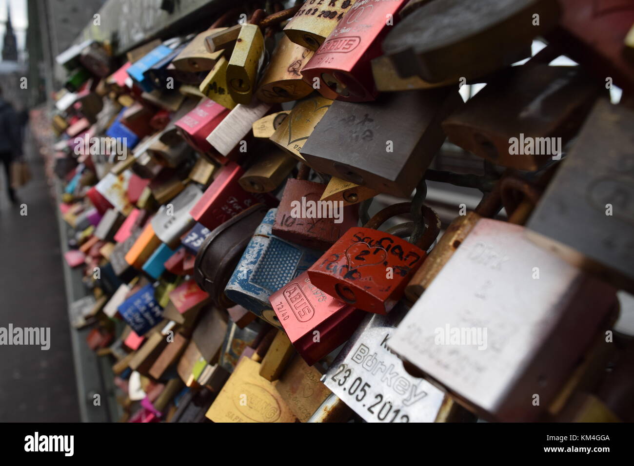 Padlocks on a bridge, put there by couples in a promise to stay