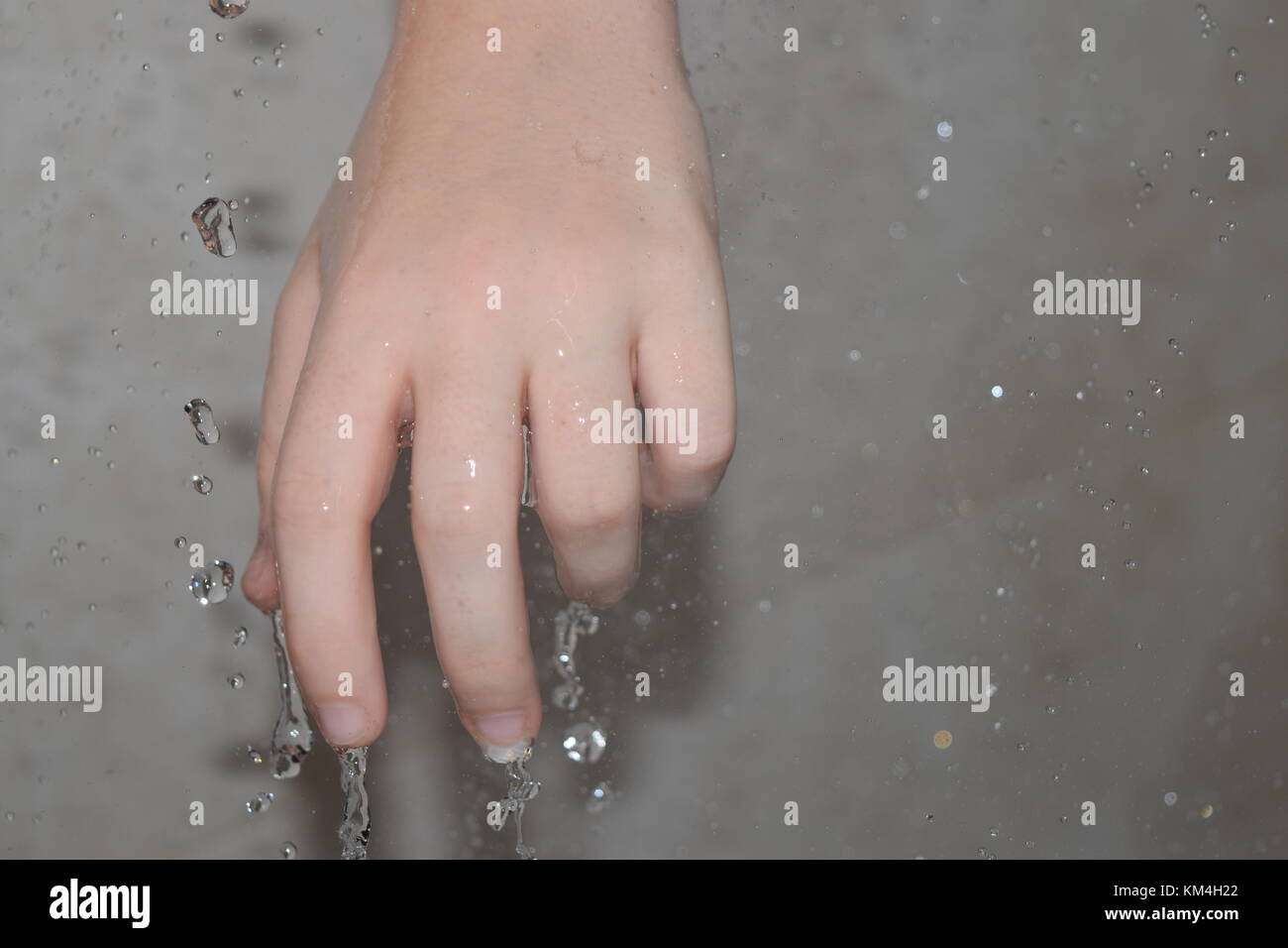 Shower water running off of hand Stock Photo Alamy