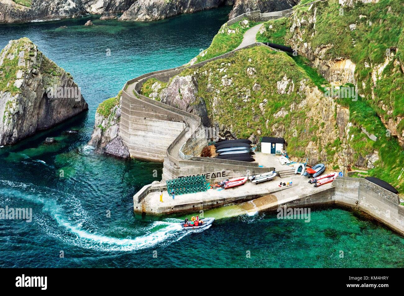 Small sheltered harbour at Dunquin services boats for the Blasket Islands. West tip of the Dingle peninsula, Co. Kerry, Ireland. Stock Photo