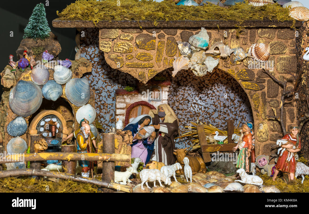 Christmas nativity scene represented with statuettes of Mary, Joseph, Jesus and other characters of the crib. Original representation. Stock Photo