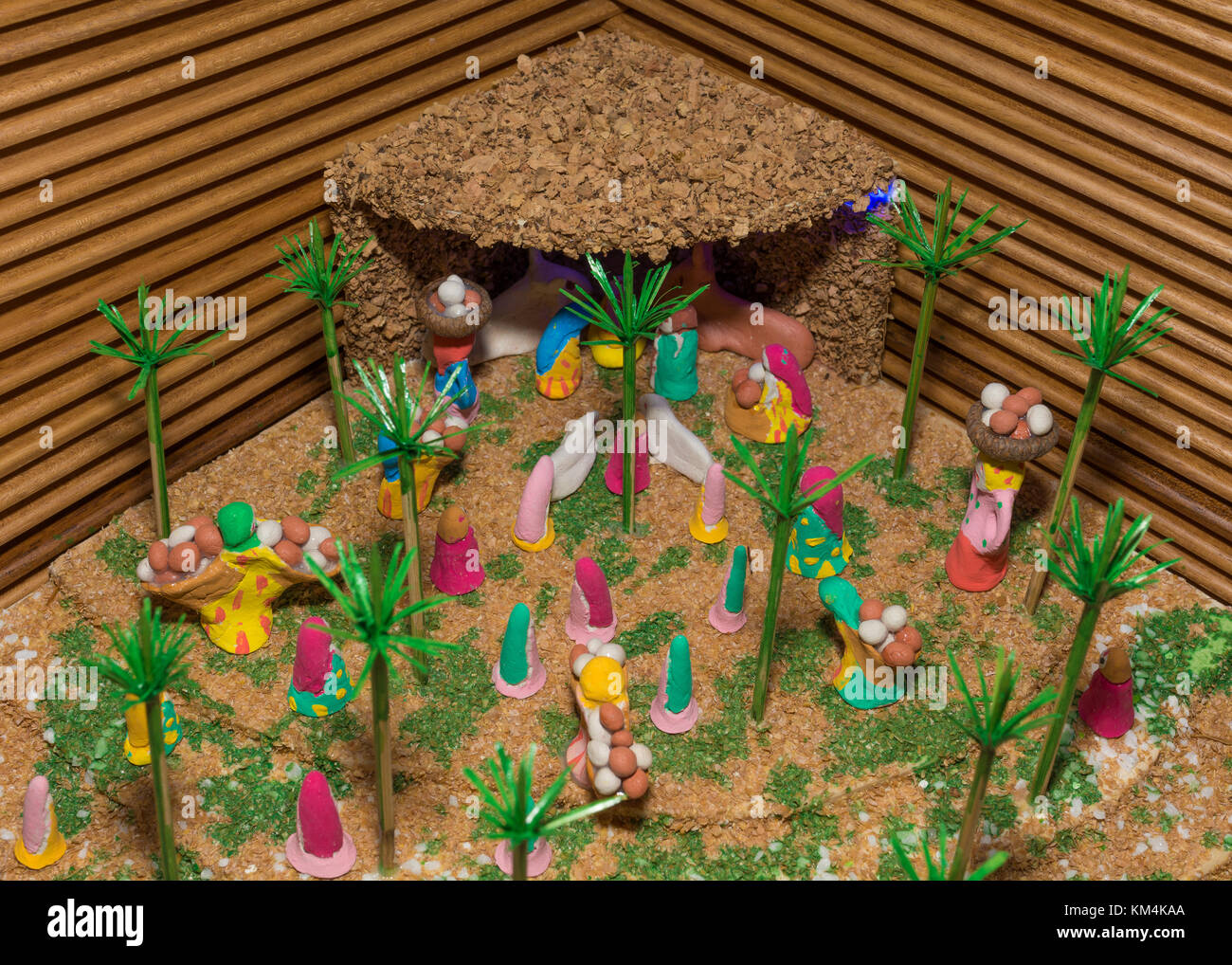 Christmas nativity scene represented with statuettes of Mary, Joseph, Jesus and other characters of the crib. Original representation. Stock Photo