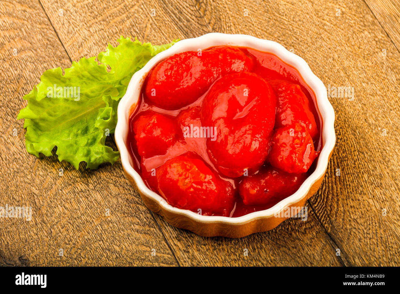 Peeled tomatoes with juice in the bowl Stock Photo Alamy