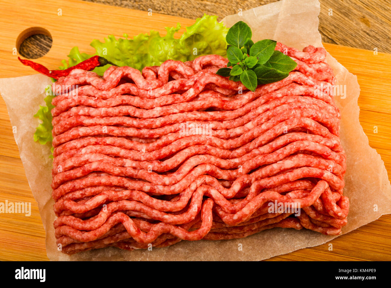 Minced beef meat with basil leaves ready for cooking Stock Photo Alamy