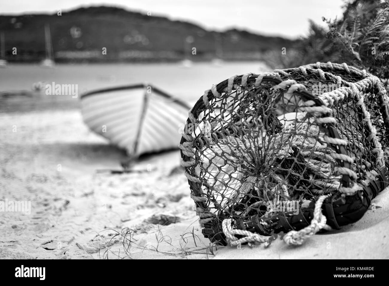 Lobster Pot and Boat Bryher Isles of Scilly, Cornwall, UK Stock Photo
