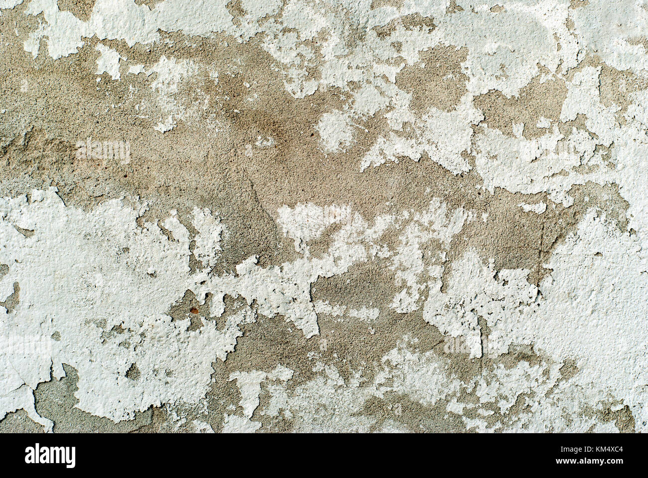 texture, background: old concrete wall with peeling plaster and crumbling whitewash Stock Photo