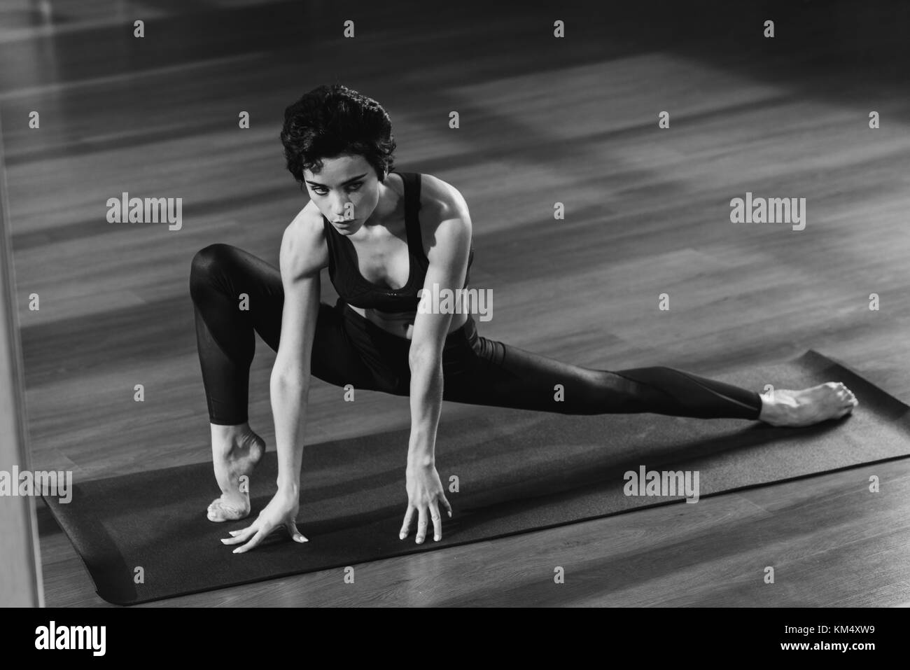 woman stretching on yoga mat Stock Photo Alamy