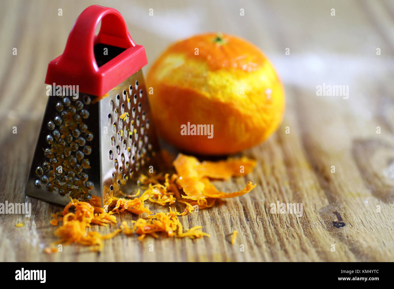 grater zest of citrus fruit and on wooden table Stock Photo Alamy