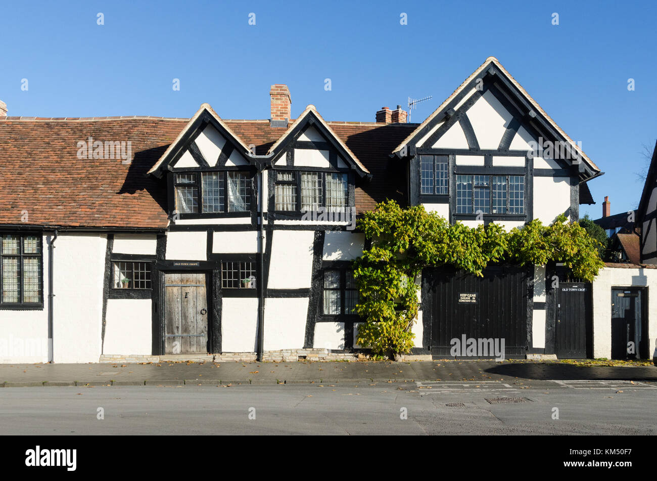Crooked black and white timber-framed house in Stratford-upon-Avon, Warwickshire, UK Stock Photo