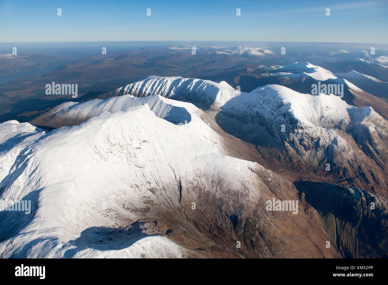 An aerial view of Nevis Range in Winter clearly showing the summits of Aonach Mor, Aonach Beag, Carn Mor Dearg and Ben Nevis, Britain's highest summit Stock Photo