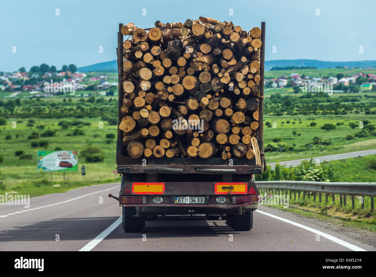 Truck loaded with wood logs on the road in Ukraine Stock Photo - Alamy