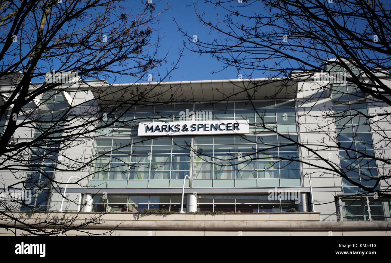 Marks & Spencers logo on shop at WestQuay shopping complex in Southampton England. Breaking through the trees. Stock Photo