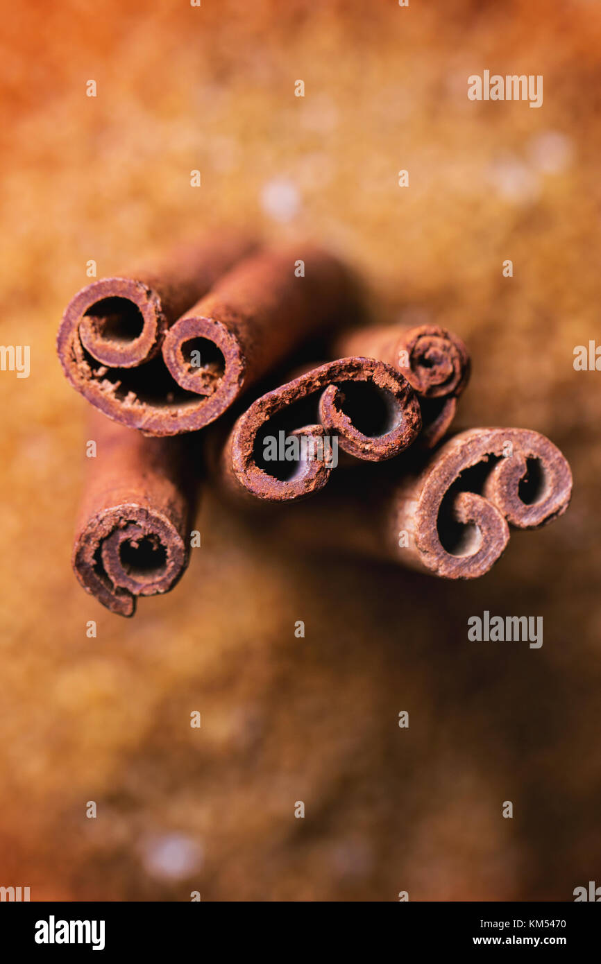 Spices cinnamon over heap of brown sugar. Top view. See series Stock Photo