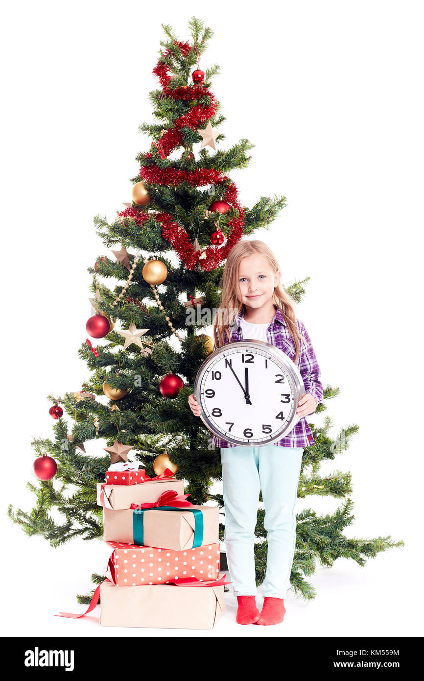 Girl near Christmas tree Stock Photo