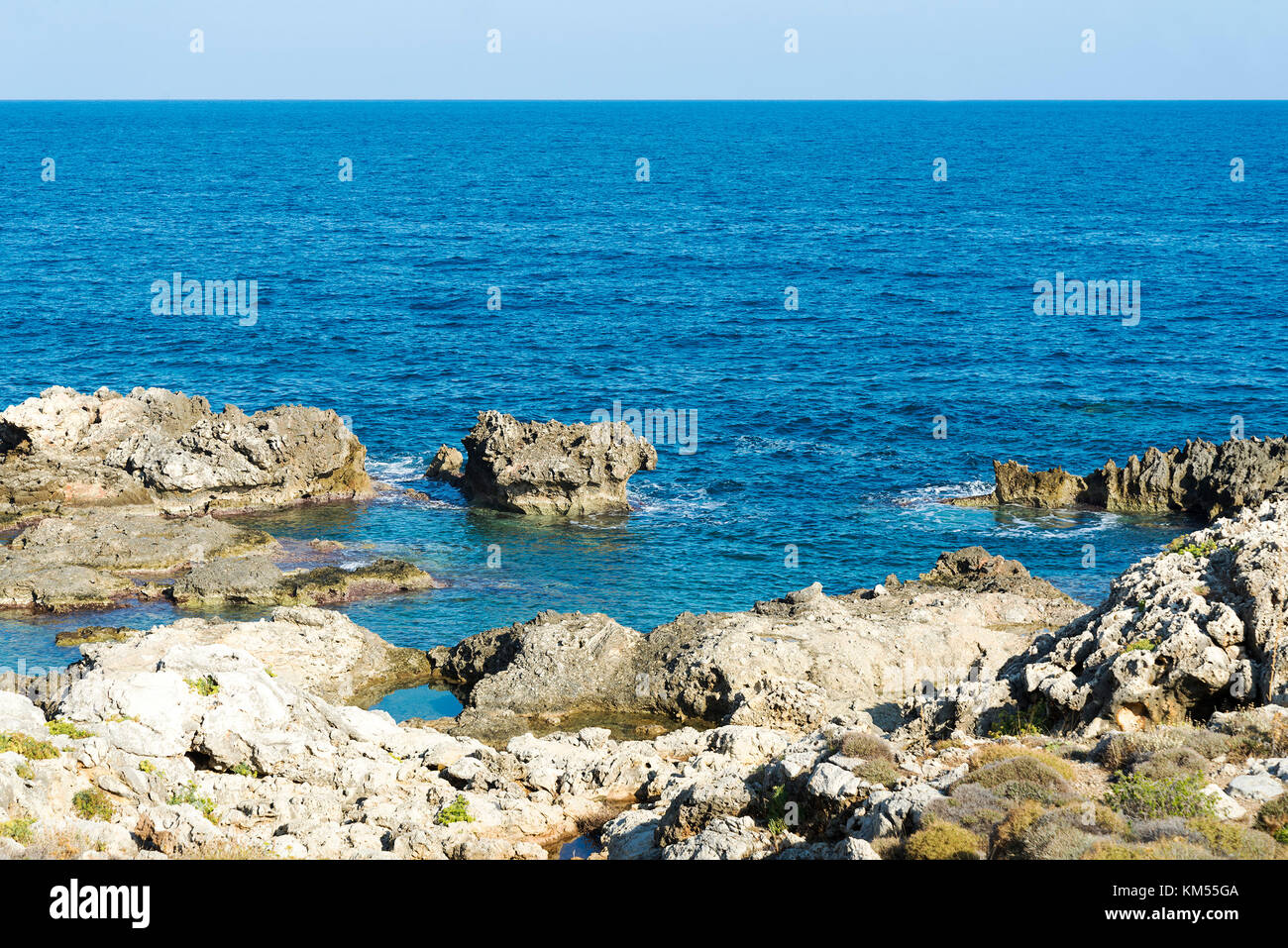 The waves breaking on a stony beach, forming a spray. Wave and splashes ...