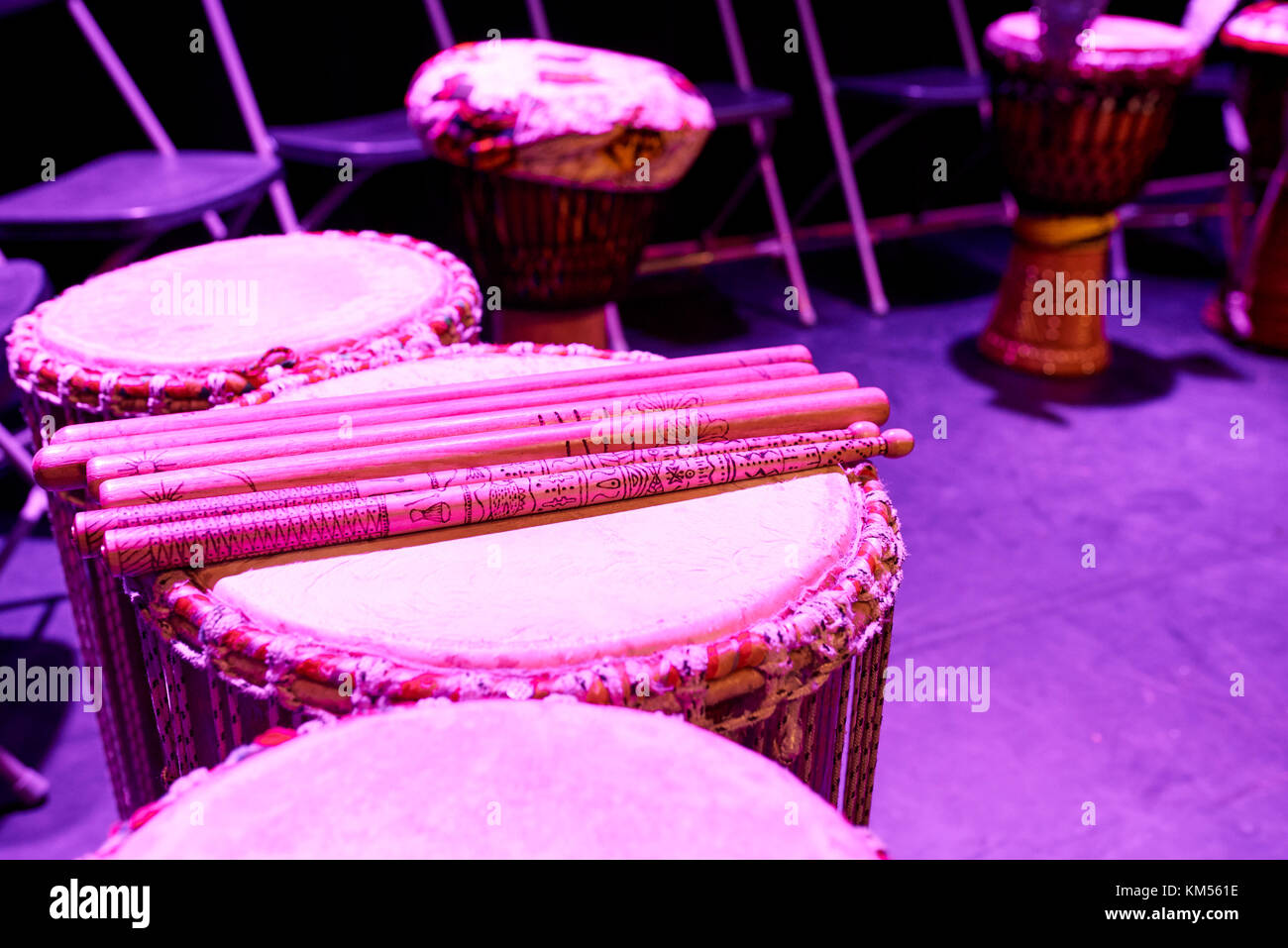 Ethnic drums with drumstics on stage Stock Photo Alamy