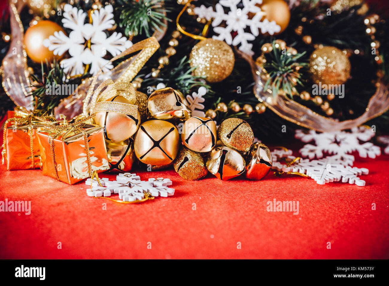 Christmas card with fir tree branch decorated with golden baubles ...