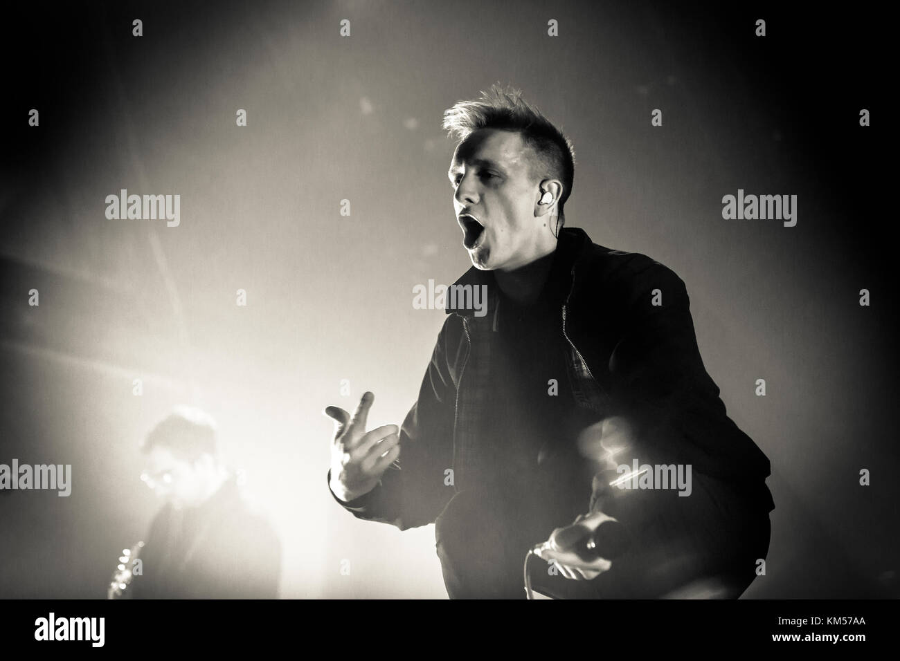 The German indie rock band Kraftklub combines different genres such as rock and rap and here performs a live concert at Palladium in Cologne. Here vocalist Felix Brummer is pictured live on stage. Germany, 26/02 2015. Stock Photo
