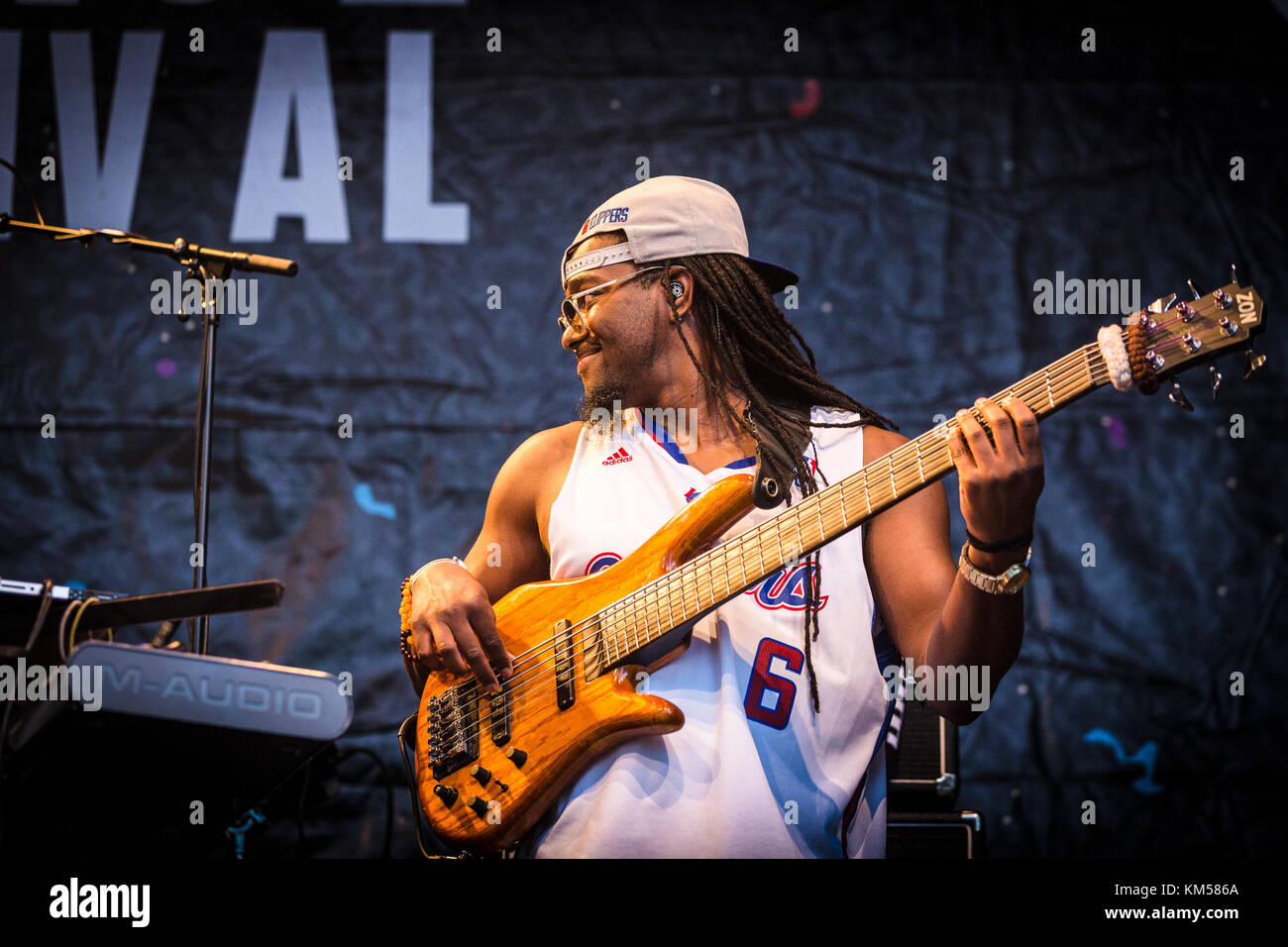 The American rapper and lyricist Oddisee performs a live concert with the live band Good Compny at the German music festival Open Source Festival 2016 in Düsseldorf. Here Live band memeber Mr. Turner is seen on bass. Germany, 09/07 2016. Stock Photo