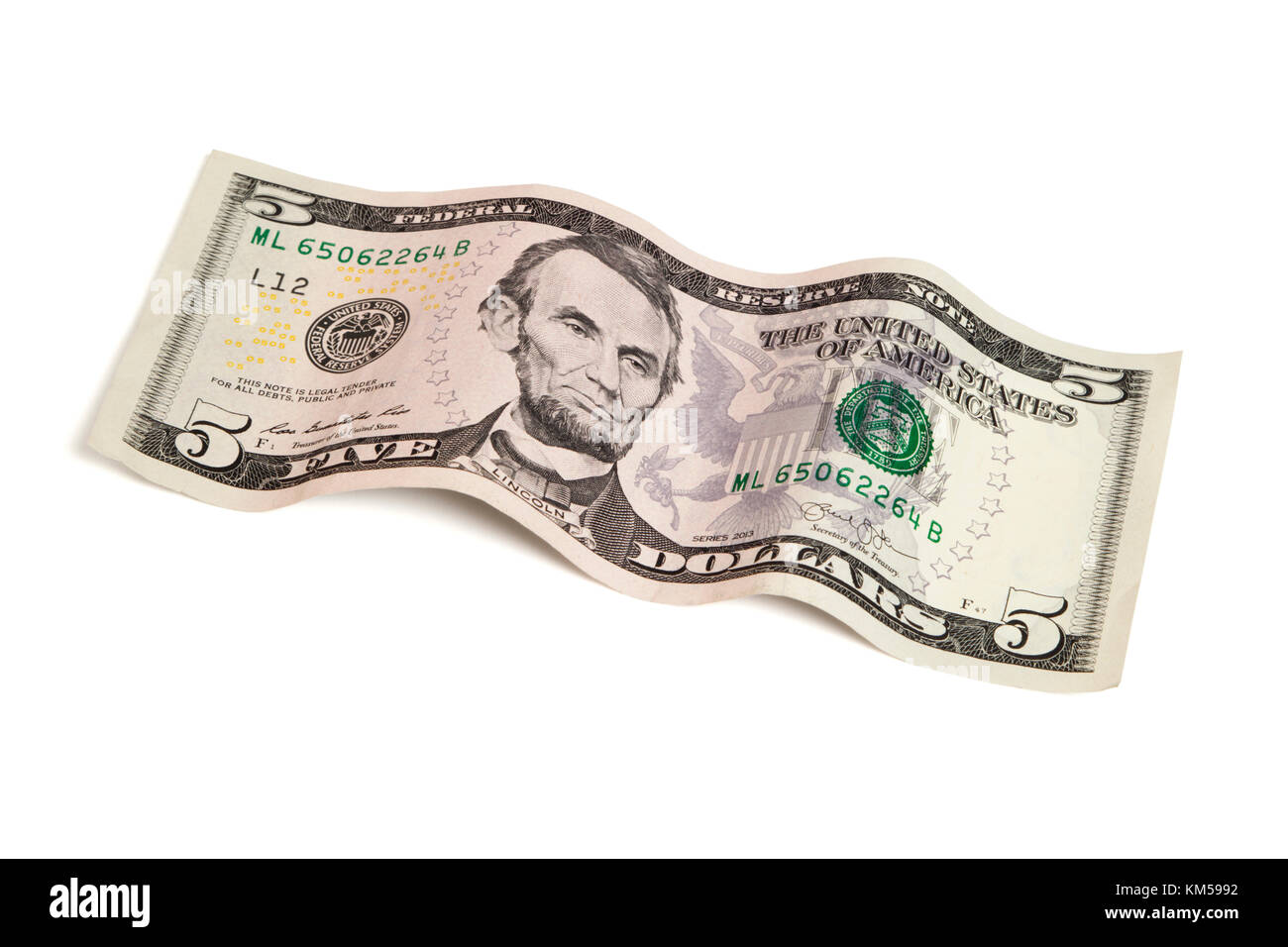 5 dollar bill in wave shape isolated with clipping path Stock Photo
